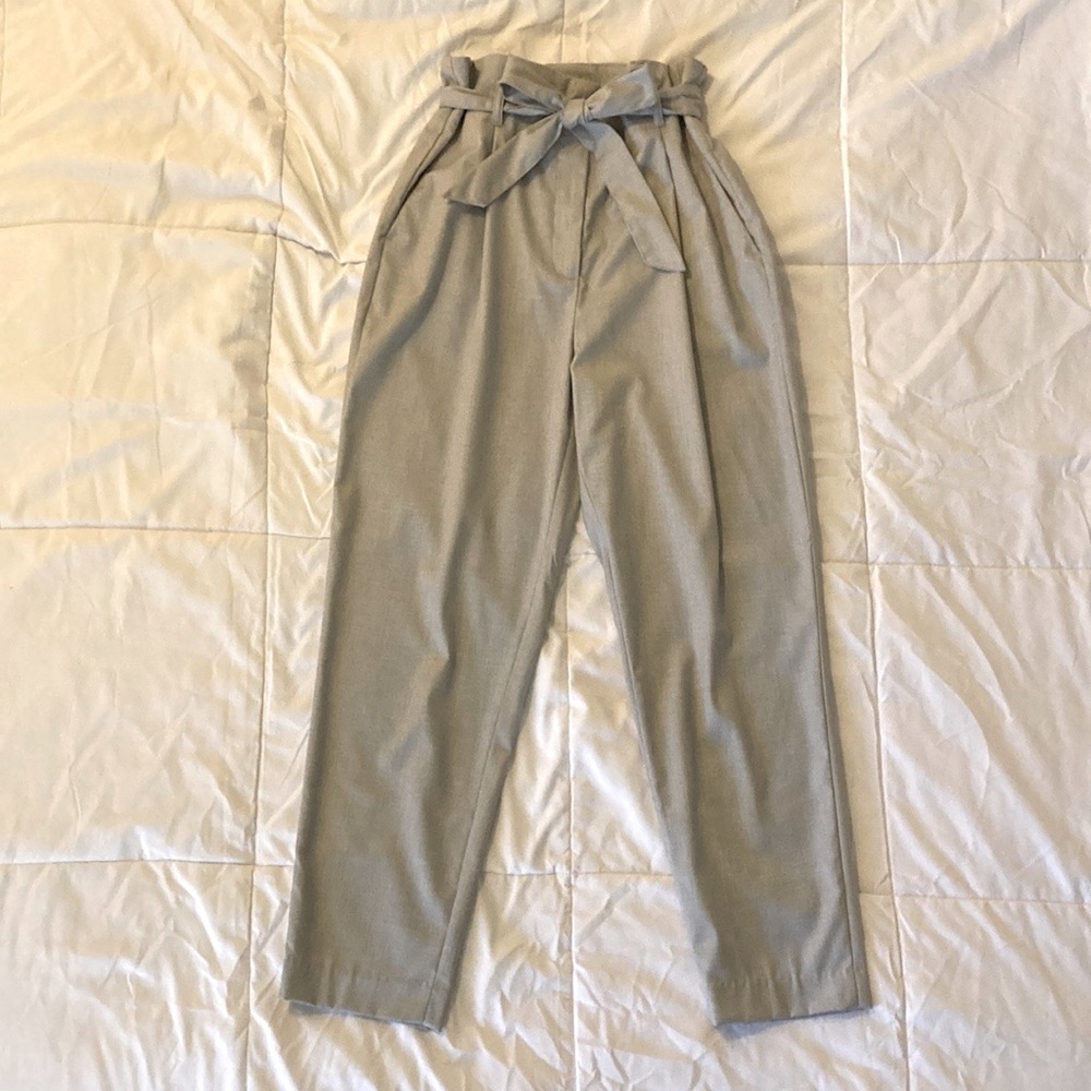 Ankle-length grey pleated paper bag slacks from H&M